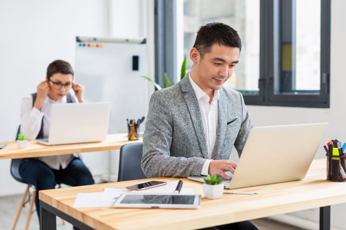 Two office colleagues working seamlessly with the help of ERP software