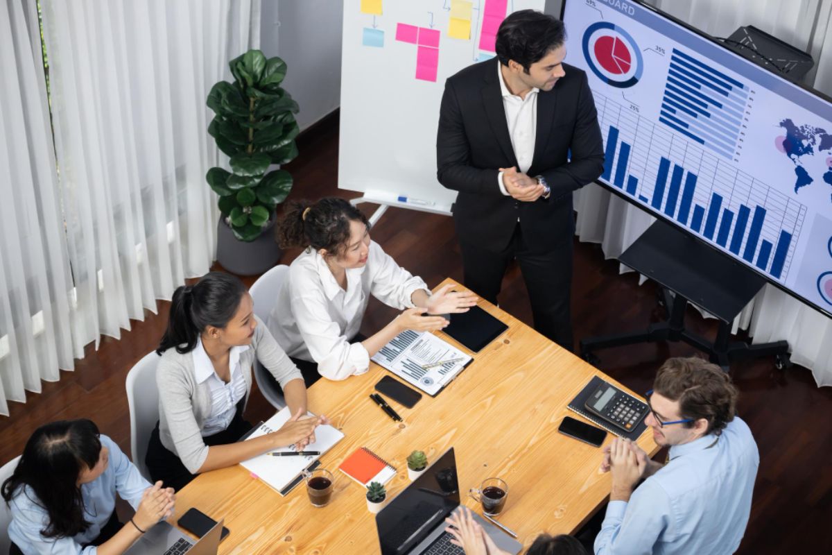 A business meeting discussing ERP software upgrades