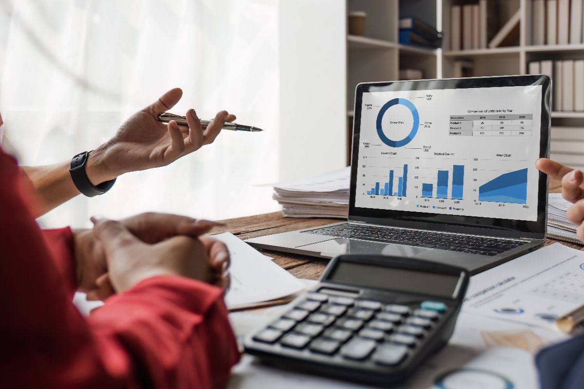 A team taking look at a report generated by an accounting system