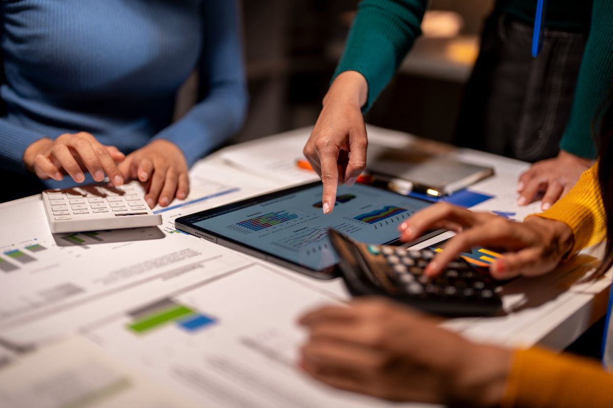 A team looking over financial data on a digital accounting sytem