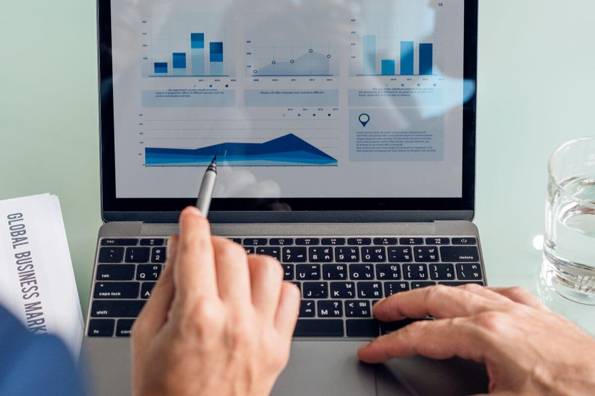 a laptop with graphs showing how SAP provides real-time visibility and tracking