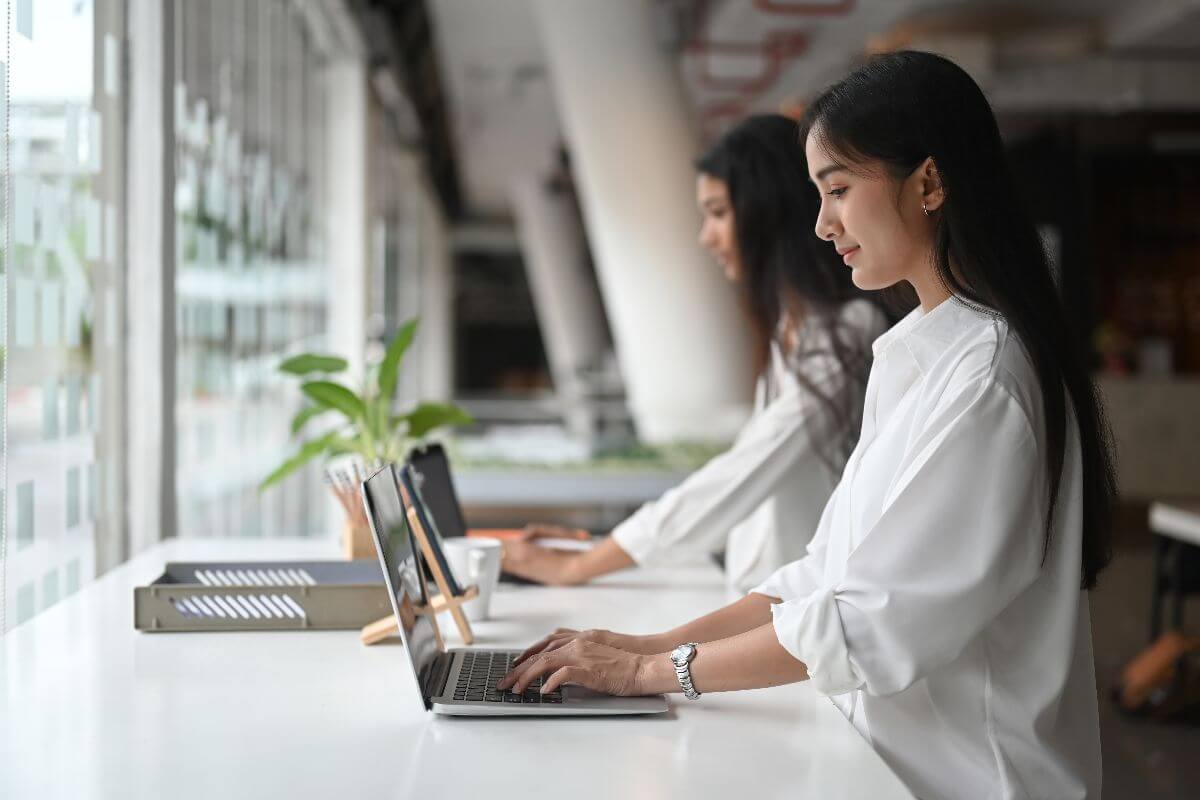 office workers using a centralized system to avoid revenue and growth bottlenecks
