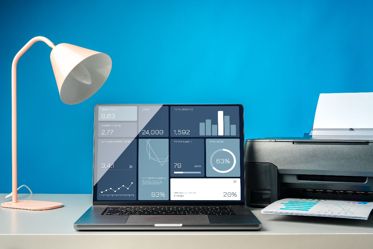 laptop with systemized sales and crm automation set against blue wall