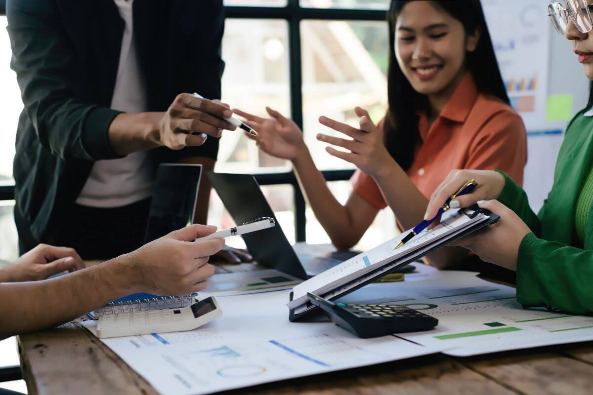employees in an office using manual workarounds