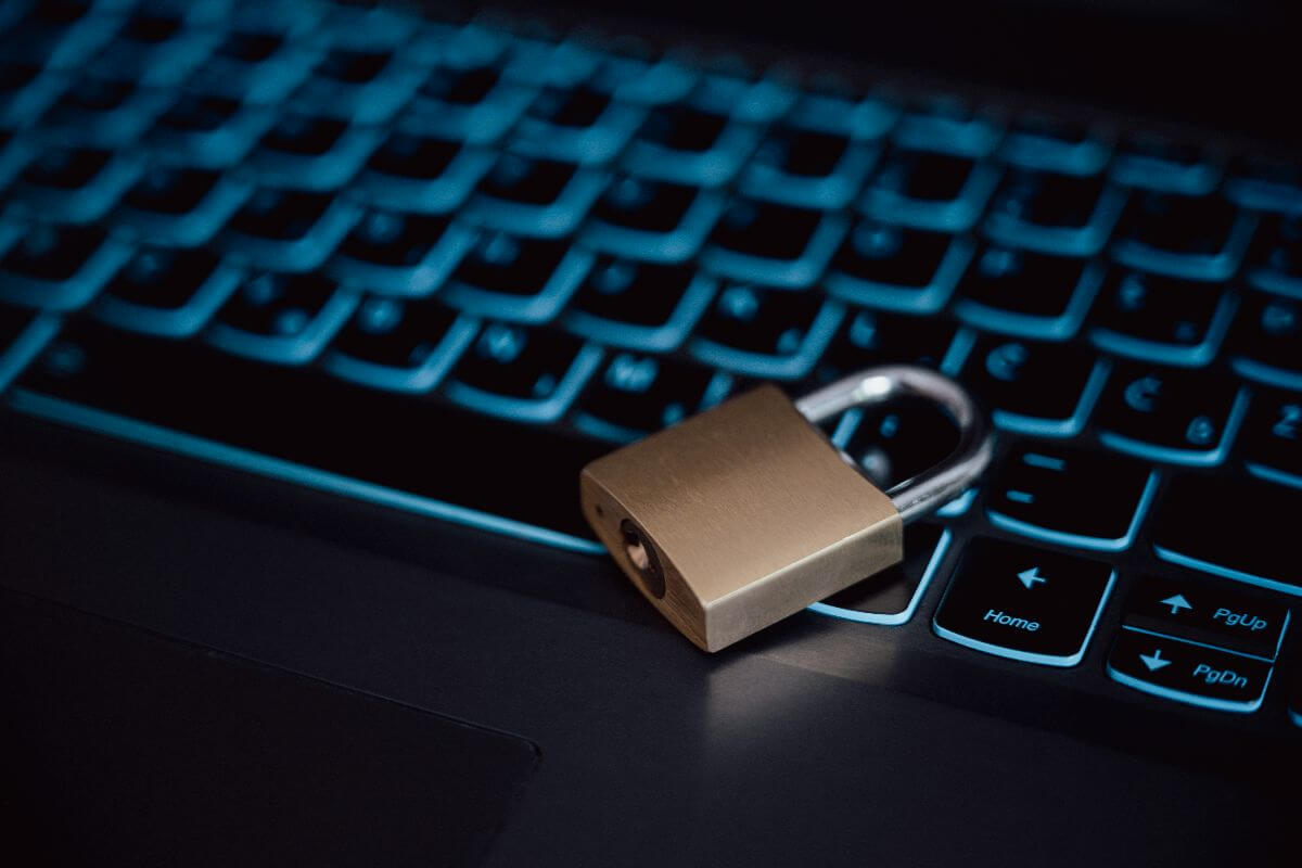 concept photo padlock on blue keyboard for enhanced security